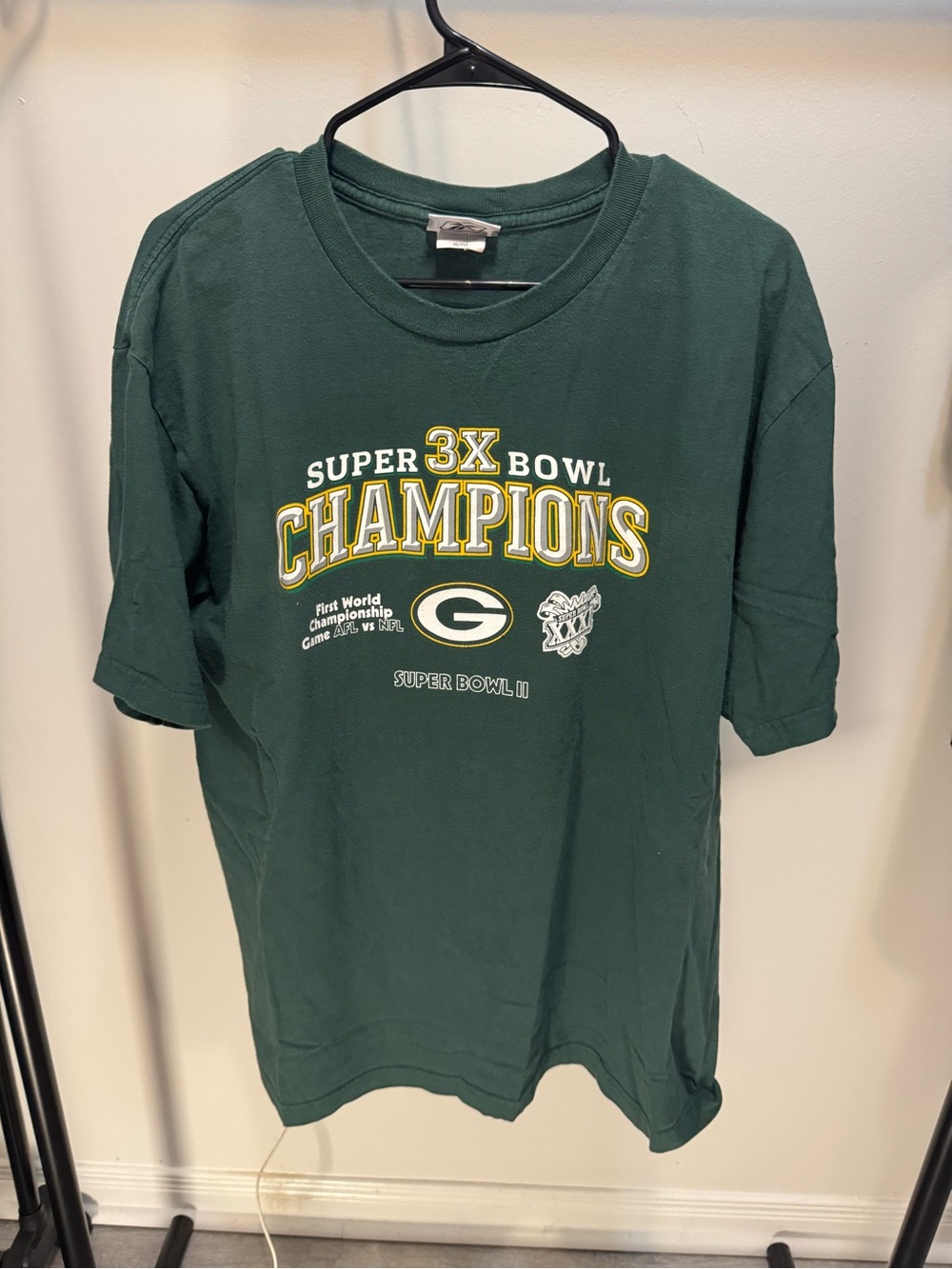 Reebok Dark Green Graphic Championship Tee with Yellow Accents